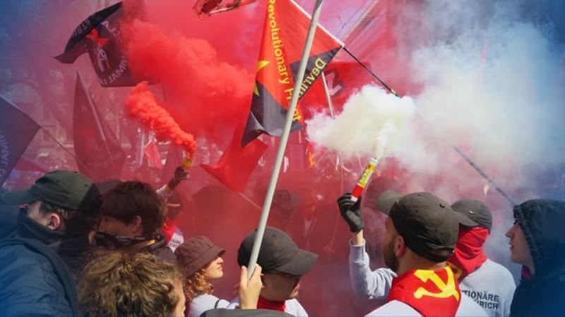 people celebrating socialism/communism, an anti-God worldview